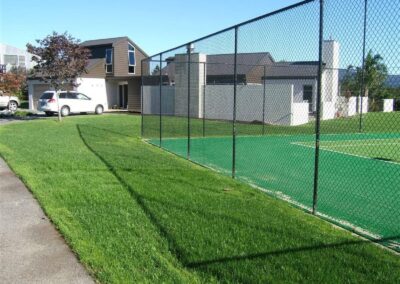 Established lawn beside the tennis court
