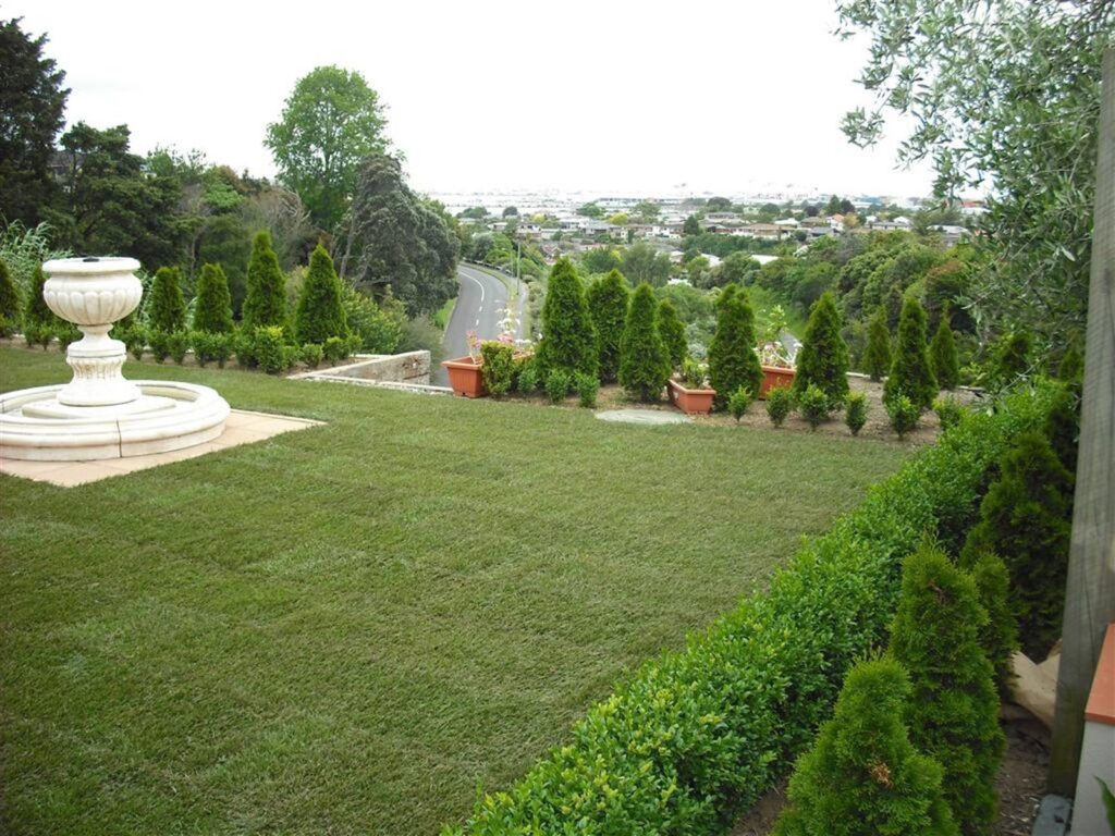 Finished instant lawn beside a formal fountain garden