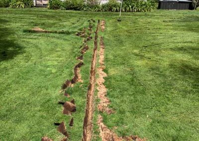 Trenching irrigation lines across a lawn